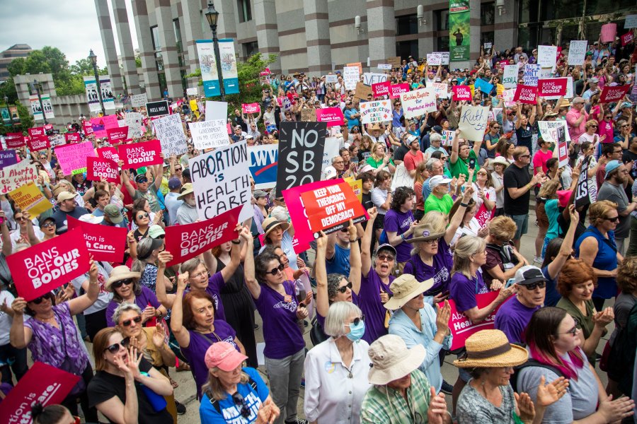 FILE - Hundreds of abortion ban veto supporters turned out to watch North Carolina Gov. Roy Cooper sign a veto of the on Bicentennial Mall in Raleigh Saturday, May 19, 2023. Abortion providers in North Carolina filed a federal lawsuit Friday, June 16, 2023, that challenges several provisions of a state law banning most abortions after 12 weeks of pregnancy in the dwindling days before the new restrictions take effect.(Travis Long/The News & Observer via AP, File)