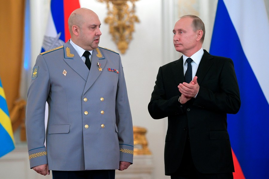 FILE - Russian President Vladimir Putin, right, applauds Col. Gen. Sergei Surovikin during an awards ceremony for troops who fought in Syria, in the Kremlin, in Moscow, Russia, Dec. 28, 2017. Russia’s president has succeeded in exiling Wagner mercenary head Yevgeny Prigozhin, who led a brief mutiny last week, but the fate of several top generals is still unclear. There were unconfirmed reports that one of them with ties to Prigozhin has been arrested and another was mysteriously absent from several events attended by President Vladimir Putin and embattled Defense Minister Sergei Shoigu. (Alexei Druzhinin, Sputnik, Kremlin Pool Photo via AP, File)