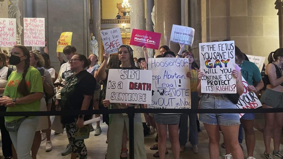 FILE - Abortion-rights protesters fill Indiana Statehouse corridors and cheer outside legislative chambers, Friday, Aug. 5, 2022, as lawmakers vote to concur on a near-total abortion ban, in Indianapolis. The Indiana Supreme Court ruled Friday, June 30, 2023, that the state's abortion ban doesn't violate the state constitution, removing a major hurdle to enforcing the ban Republicans approved last summer. (AP Photo/Arleigh Rodgers, File)