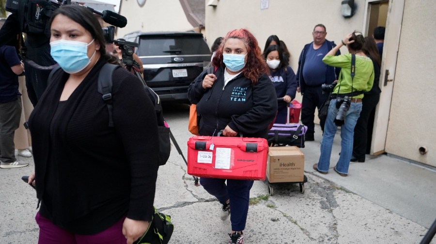 Los Angeles County Public Health Emergency Operations officials leave St. Anthony's Croatian Catholic Church after evaluating the newly arrived migrants being housed in Los Angeles on Wednesday, June 14, 2023.