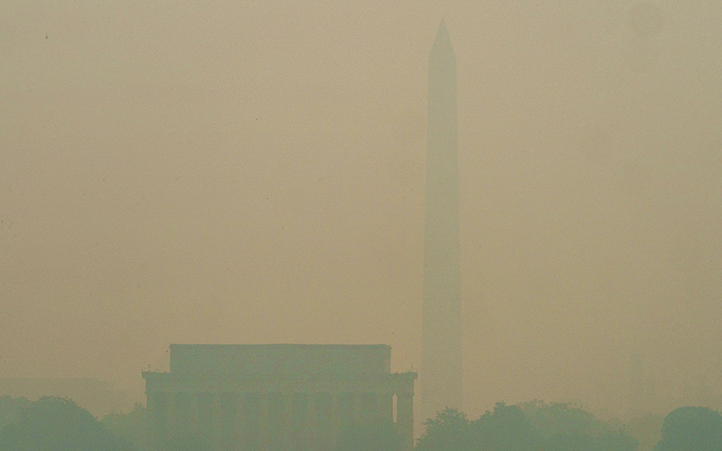 Washington, D.C., is seen through the haze from the Iwo Jima Memorial