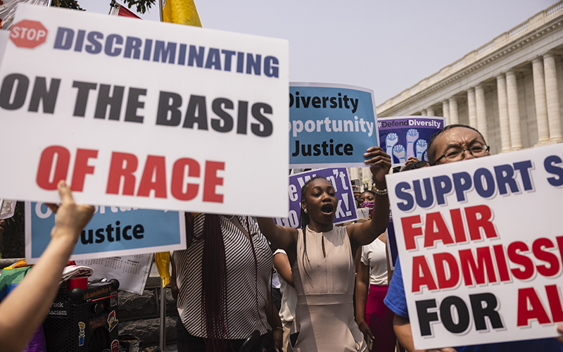 Demonstrators for and against the Supreme Court decision to strike down race-conscious student admissions programs gather outside the Supreme Court