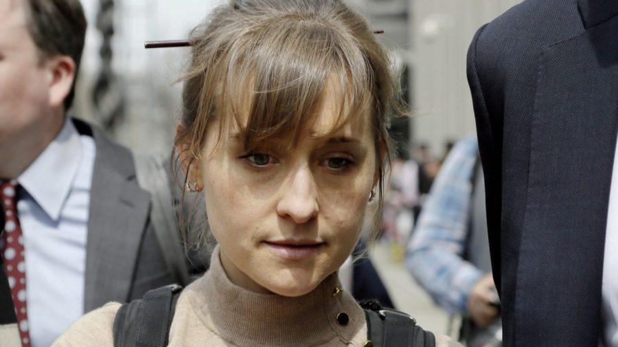 FILE - Television actor Allison Mack leaves federal court in the Brooklyn borough of New York, April 8, 2019, after pleading guilty to racketeering charges in a case involving a cult-like group based in upstate New York called NXIVM. Mack has been released from a California prison, according to a government website. Online records maintained by the Federal Bureau of Prisons said she was released Monday, July 3, 2023. (AP Photo/Mark Lennihan, File)