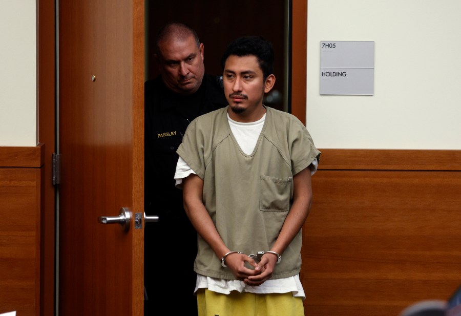 FILE - Gerson Fuentes, right, the man accused of raping and impregnating a 9-year-old Ohio girl, who at 10 had to travel to Indiana for an abortion, enters Franklin County common pleas court in Columbus, Ohio, for his bond hearing, July 28, 2022. On Wednesday, July 5, 2023, Fuentes pleaded guilty to two counts of rape. He was sentenced to life in prison but, as part of his plea deal, will be eligible to seek probation after serving 25 to 30 years. He will also have to register as a sex offender. (AP Photo/Paul Vernon, File)