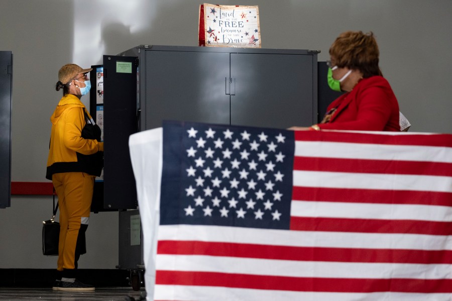 FILE - A voter marks her ballot during the first day of early voting, Oct. 17, 2022, in Atlanta. The Republican Party in Georgia's most populous county, Fulton County, filed suit on Friday, June 30, 2023, against local elected officials over the rejection of one of the party's nominees to serve on the county election board, saying he was being punished for trying to clean up voter rolls. (AP Photo/Ben Gray, File)