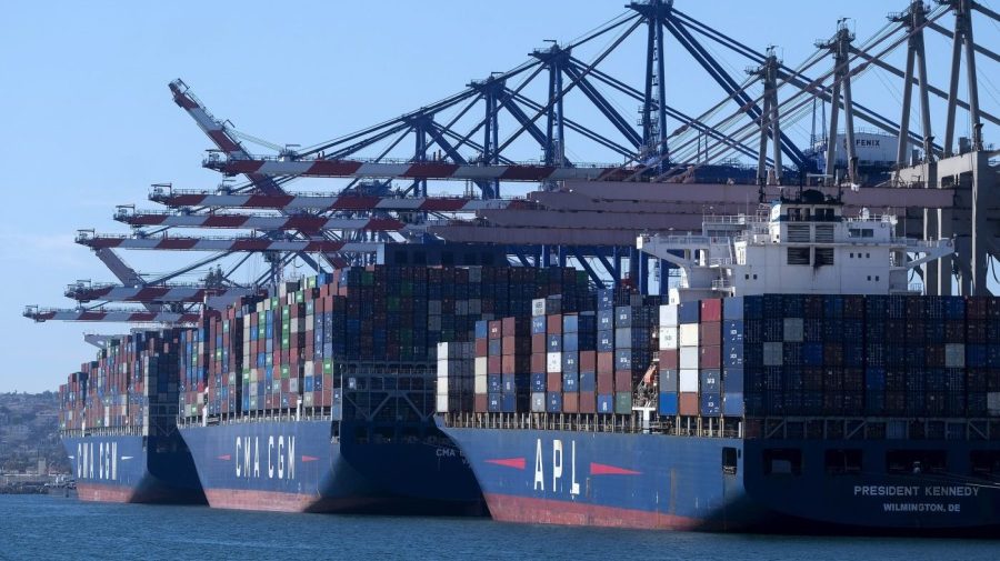 FILE - Cargo containers sit stacked on ships at the Port of Los Angeles, Wednesday, Oct. 20, 2021 in San Pedro, Calif.