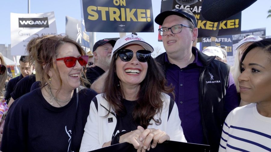 Actor Joely Fisher, from left, SAG-AFTRA president Fran Drescher and Duncan Crabtree-Ireland, SAG-AFTRA national executive director and chief negotiator, take part in a rally by striking writers and actors outside Netflix studio in Los Angeles on Friday, July 14, 2023.