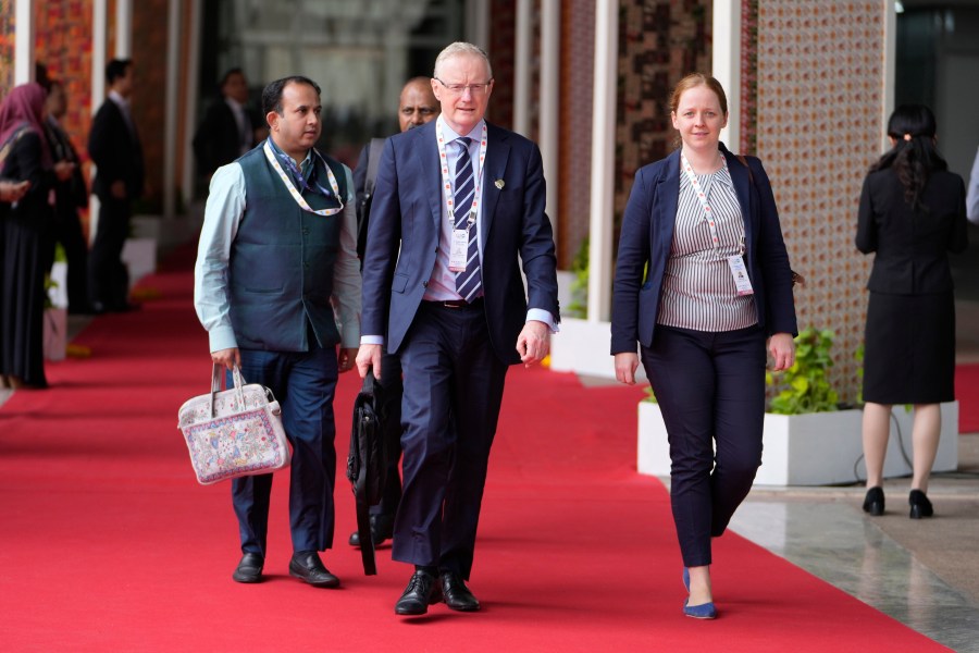 Australia's Reserve Bank Governor Philip Lowe, center, arrives to attend G-20's third Finance Ministers and Central Bank Governors (FMCBGs) meeting in Gandhinagar, India, Monday, July 17, 2023. (AP Photo/Ajit Solanki)