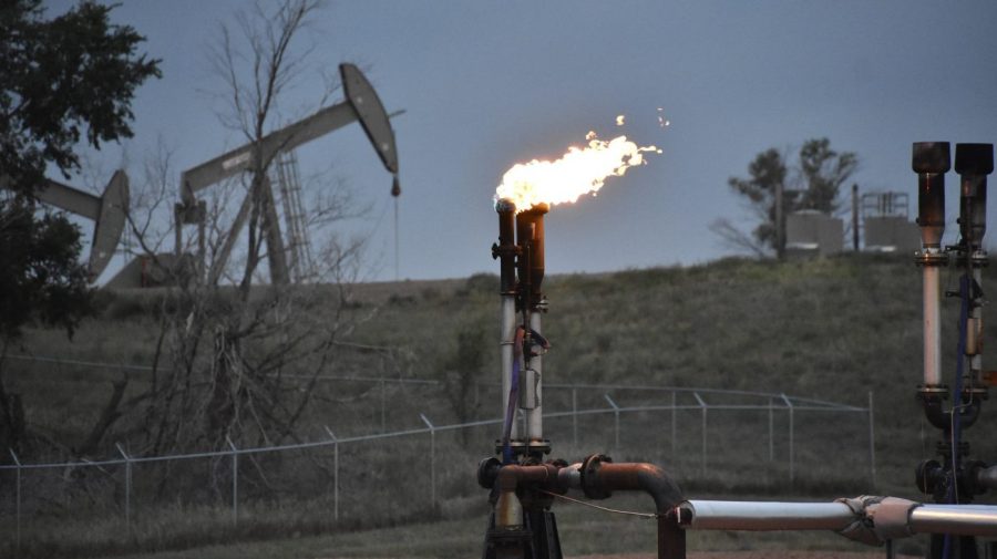 A flare burns methane from oil production.