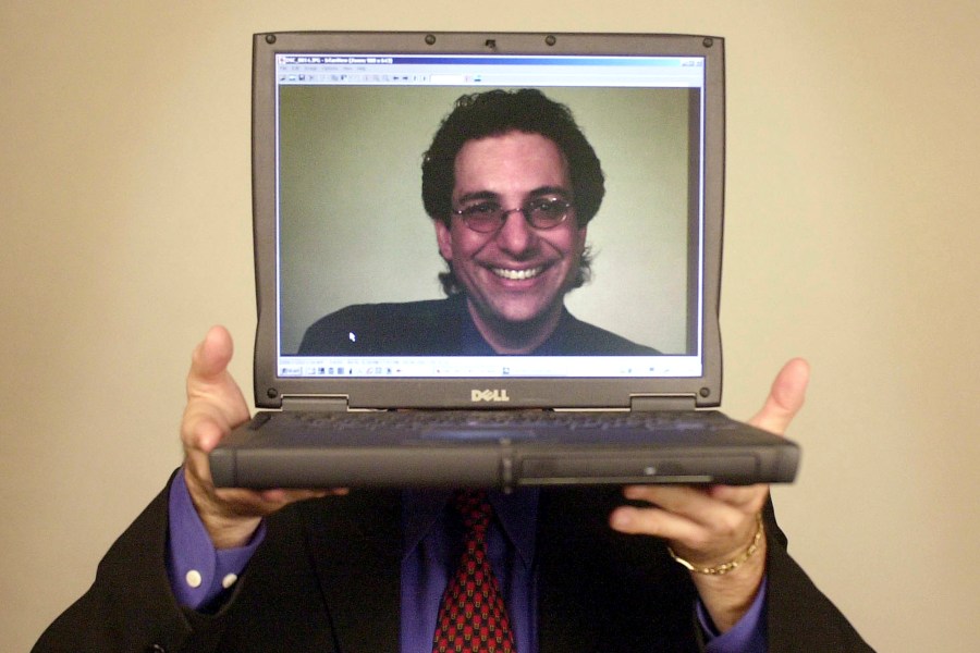 FILE - Computer hacker turned author Kevin Mitnick poses for a portrait Thursday, June 27, 2002, in Las Vegas. Mitnick, whose pioneering antics tricking employees in the 1980s and 1990s into helping him steal software and services from big phone and tech companies made him the most celebrated U.S. hacker, has died at age 59. (AP Photo/Joe Cavaretta, File)