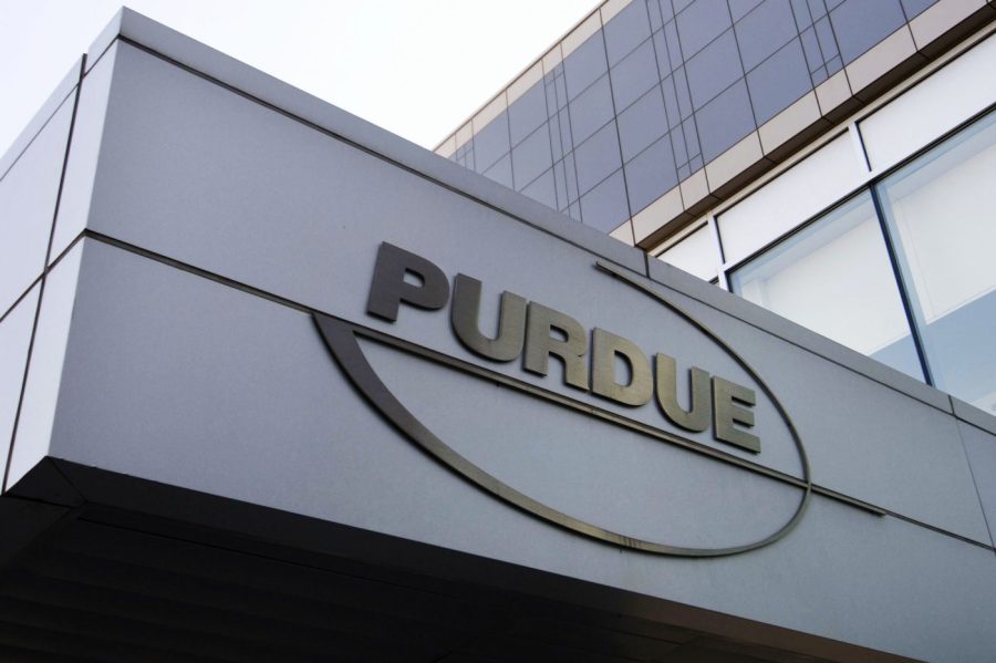 The logo for pharmaceutical giant Purdue Pharma is displayed outside its offices.