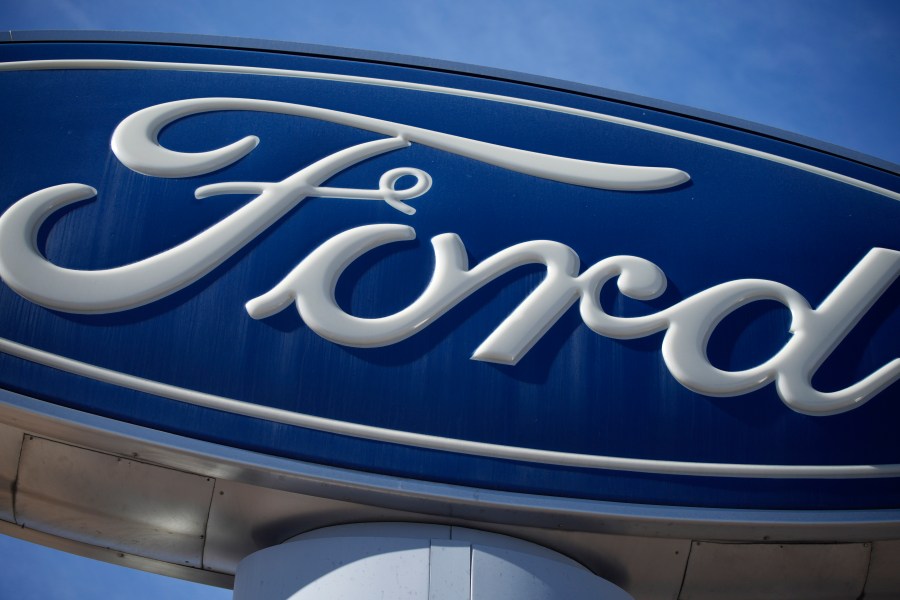 FILE - This Oct. 24, 2021 file photo shows a Ford company logo on a sign at a Ford dealership in southeast Denver. Ford Motor is reporting earnings on Thursday, July 27, 2023. (AP Photo/David Zalubowski, File)