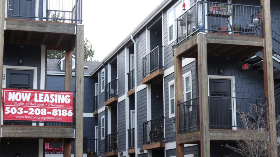 FILE - A 'Now Leasing' sign hangs off an apartment building staircase in southeast Portland, Ore., Dec. 9, 2021. The White House has announced a series of measures that it said would reduce the cost and increase the supply of housing while bolstering protection for renters. The measures announced Thursday, July 27, 2023, would provide communities with funding to reduce zoning barriers, expand financing for affordable and energy efficient housing as well as promoting the conversion of commercial buildings to residential housing. (AP Photo/Sara Cline, File)