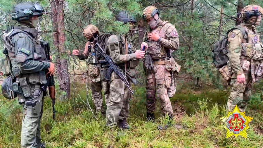 FILE - In this grab taken from video released by Belarus' Defense Ministry on Thursday, July 20, 2023, Belarusian soldiers of the Special Operations Forces (SOF) and mercenary fighters from Wagner private military company attend the weeklong maneuvers conducted at a firing range near the border city of Brest, Belarus. The Polish prime minister says that over 100 mercenaries belonging to the Russian-linked Wagner group in Belarus have moved close to the border with Poland. Mateusz Morawiecki said at a news conference Saturday, July 29, 2023 that the mercenaries had moved close to the Suwalki Gap, a strategic stretch of Polish territory situated between Belarus and Kaliningrad, a Russian territory separated from the mainland. (Belarus' Defense Ministry via AP, File)