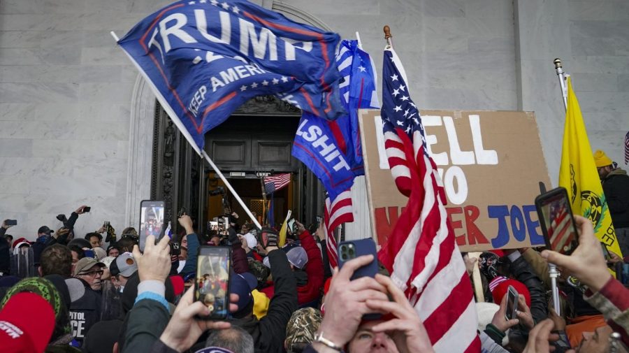 In this Jan. 6, 2021, file photo, Trump supporters gather outside the Capitol in Washington.