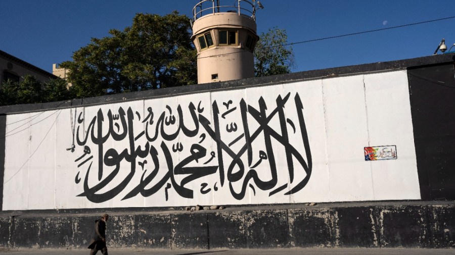 A man walks in front of the former U.S. Embassy in Kabul, Afghanistan, Thursday, June 8, 2023. (AP Photo/Rodrigo Abd)