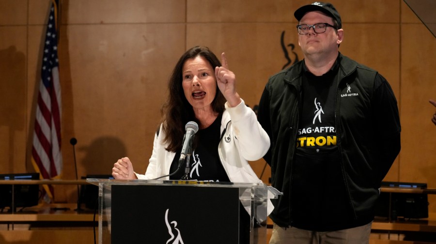 SAG-AFTRA president Fran Drescher, left, and SAG-AFTRA National Executive Director and Chief Negotiator Duncan Crabtree-Ireland speak during a press conference announcing a strike by The Screen Actors Guild-American Federation of Television and Radio Artists on Thursday, July, 13, 2023, in Los Angeles.