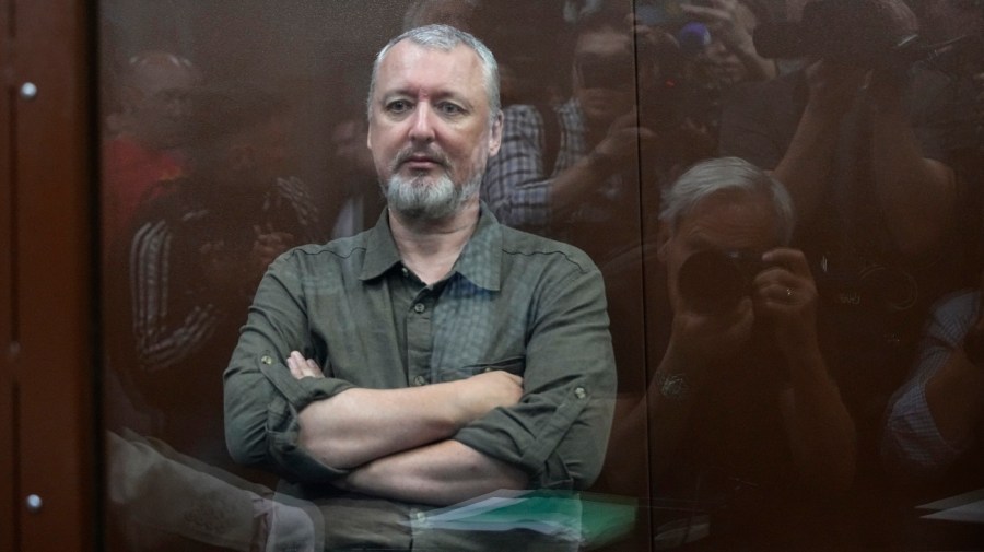 Igor Girkin also know as Igor Strelkov, the former military chief for Russia-backed separatists in eastern Ukraine, sits in a glass cage in a courtroom at the Moscow's Meshchansky District Court in Moscow, Russia, Friday, July 21, 2023. (AP Photo/Alexander Zemlianichenko, Pool)