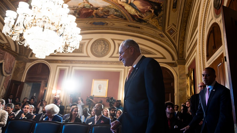 Majority Leader Chuck Schumer (D-N.Y.) walks into a press conference to reintroduce the Freedom to Vote Act