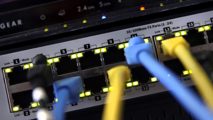 A router and internet switch are displayed in a close-up.