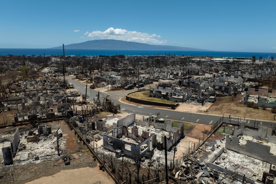 FILE - The aftermath of a devastating wildfire in Lahaina, Hawaii, Tuesday, Aug. 22, 2023. Shares of Hawaiian Electric Company's parent fell more than 16% on Friday, Aug. 25, one day after the utility was sued by Maui County over the fires that devastated Lahaina earlier this month. (AP Photo/Jae C. Hong, File)