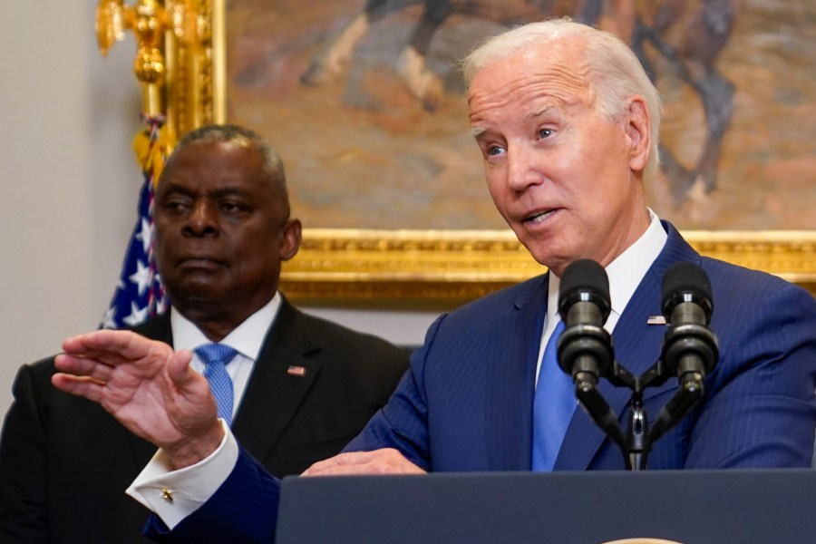 President Joe Biden delivers remarks on recovery efforts for the Maui wildfires and the response to Hurricane Idalia, in the Roosevelt Room of the White House, Wednesday, Aug. 30, 2023, in Washington. Secretary of Defense Lloyd Austin, left, stand sbehind Biden. (AP Photo/Evan Vucci)