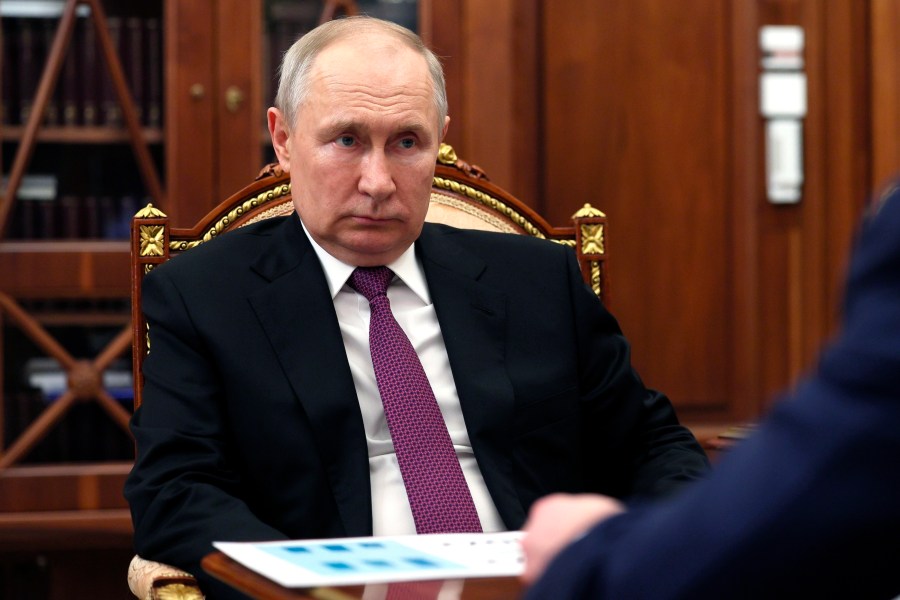 Russian President Vladimir Putin listens to Igor Shuvalov, chairman of the Russian state development corporation VEB.RF during their meeting at the Kremlin in Moscow, Russia, Wednesday, Aug. 30, 2023. (Gavriil Grigorov, Sputnik, Kremlin Pool Photo via AP)