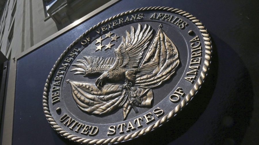 A seal is displayed on the front of the Veterans Affairs Department building.