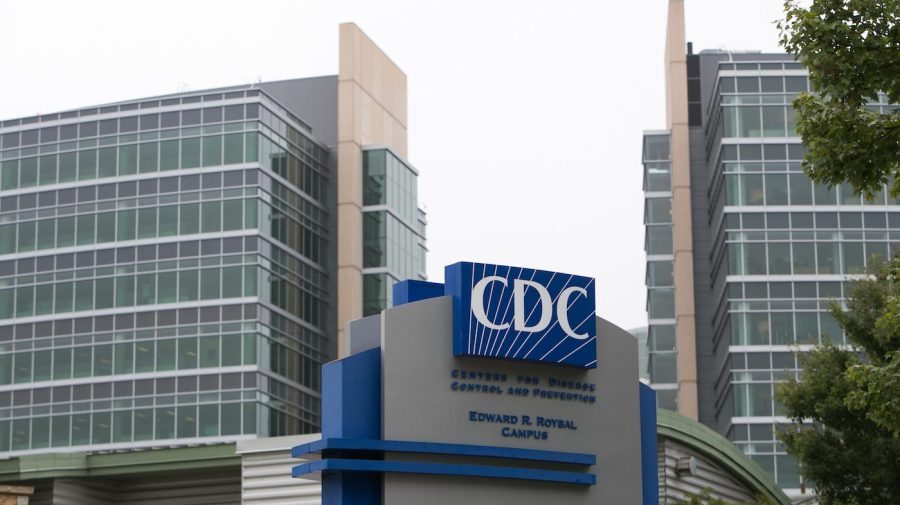 The CDC logo is seen on a sign on a building.