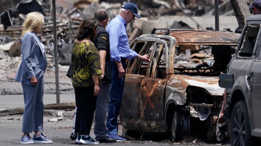 President Joe Biden and first lady Jill Biden walk with Hawaii Gov. Josh Green and his wife Jaime Green as they visit areas devastated by the Maui wildfires, Monday, Aug. 21, 2023, in Lahaina, Hawaii.