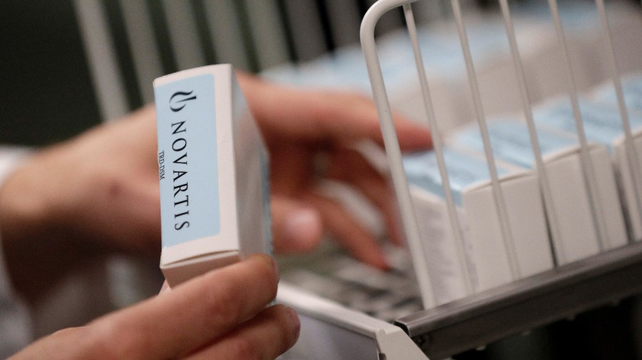 A Novartis-labeled box is cataloged prior to testing procedures Tuesday, Aug. 14, 2018 in Phoenix.