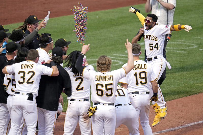 Pittsburgh Pirates' Josh Palacios (54) celebrates as he approaches home plate after hitting a two-run walk-off home run off