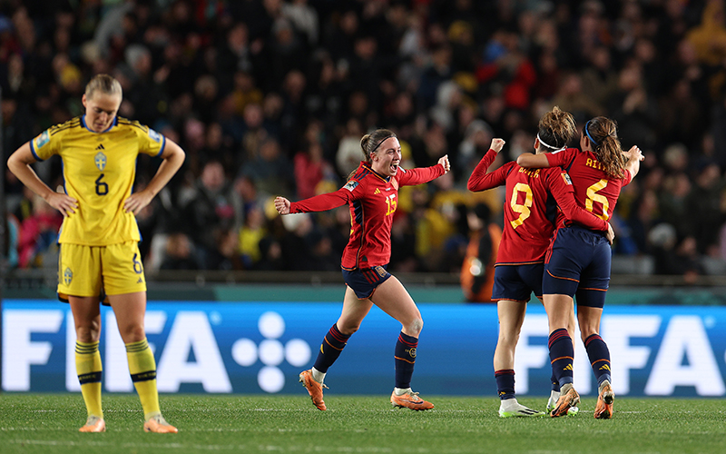 Eva Navarro, Aitana Bonmati and Esther Gonzalez of Spain celebrate the team’s 2-1 victory while a dejected opponent walks away