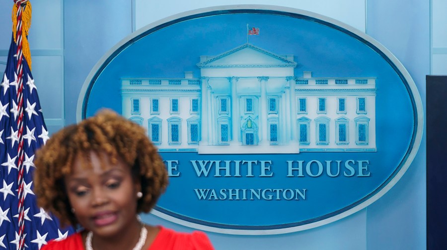 The White House logo is seen as press secretary Karine Jean-Pierre addresses reporters