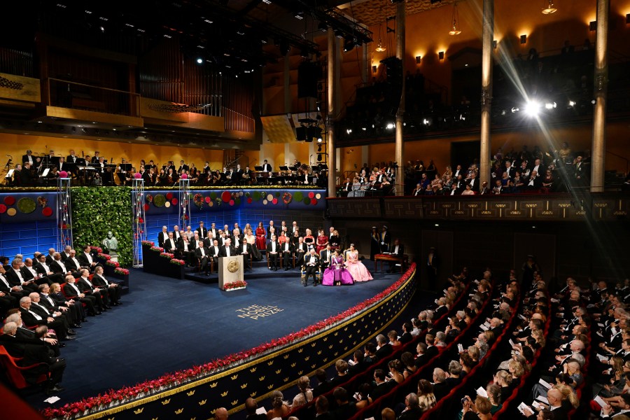 FILE - The Nobel laureates and the royal family of Sweden during the Nobel Prize award ceremony at the Concert Hall in Stockholm, Saturday Dec. 10 2022. The Nobel Foundation has withdrawn its invitation for representatives of Russia, Belarus and Iran to attend this year’s Nobel Prize award ceremonies after the decision to invite them “provoked strong reactions.” Saturday's U-turn came after several Swedish lawmakers said they would boycott this year’s Nobel Prize award ceremonies. (Pontus Lundahl/TT via AP, File)