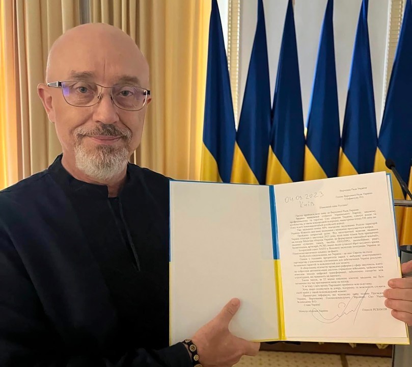 In this photo provided by the Ukrainian Parliament Press Office, Ukrainian Minister of Defense Oleksii Reznikov shows his resignation letter addressed to the Parliamentary Speaker in Kyiv, Ukraine, Monday, Sept. 4, 2023. (Ukrainian Parliament Press Office via AP)