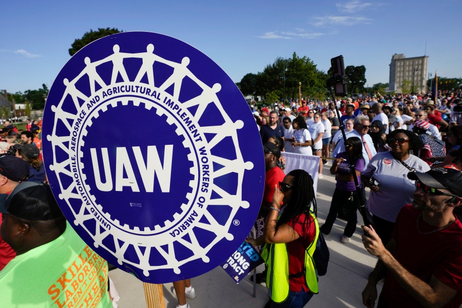 United Auto Workers members walk in the Labor Day parade in Detroit, Monday, Sept. 4, 2023. (AP Photo/Paul Sancya)