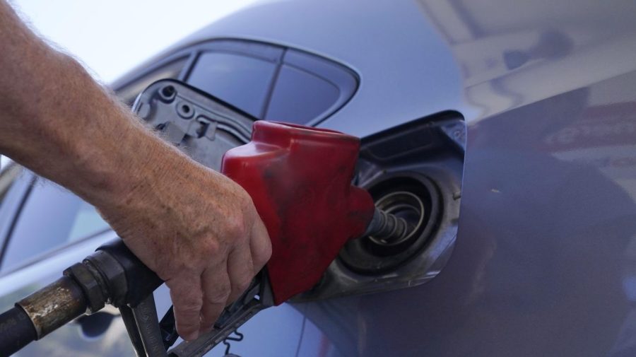 FILE - A customer pumps gas at an Exxon gas station, Tuesday, May 10, 2022, in Miami. Saudi Arabia and Russia agreed Tuesday, Sept. 5, 2023, to extend their voluntary oil production cuts through the end of this year, trimming 1.3 million barrels of crude out of the global market and boosting energy prices. The dual announcements from Riyadh and Moscow pushed benchmark Brent crude above $90 a barrel in trading Tuesday afternoon, a price unseen in the market since last November. (AP Photo/Marta Lavandier, File)