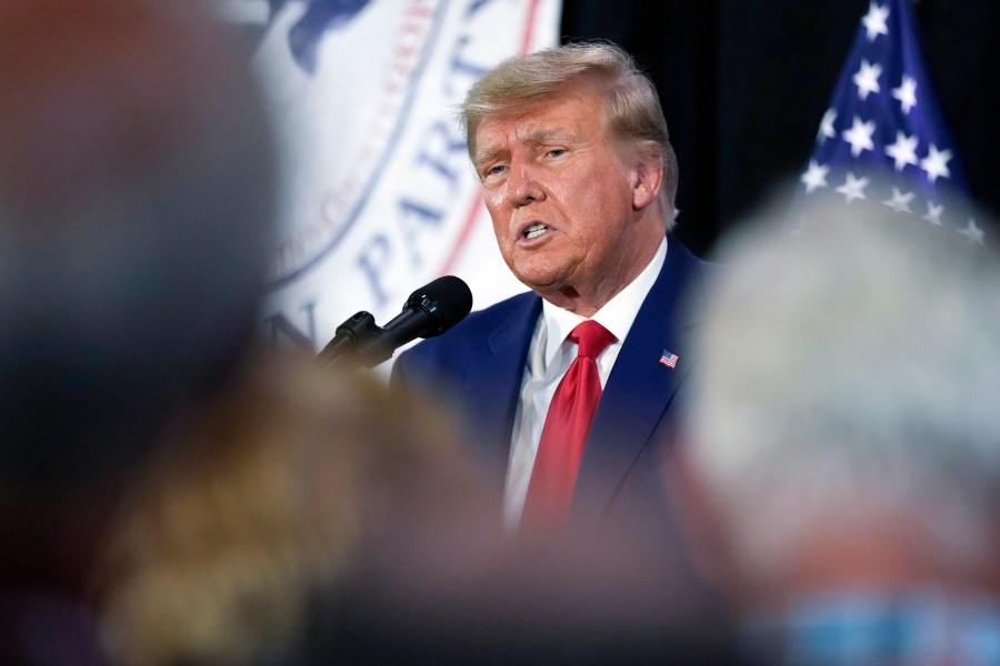 FILE - Former President Donald Trump visits with campaign volunteers at the Elks Lodge, July 18, 2023, in Cedar Rapids, Iowa. (AP Photo/Charlie Neibergall, File)