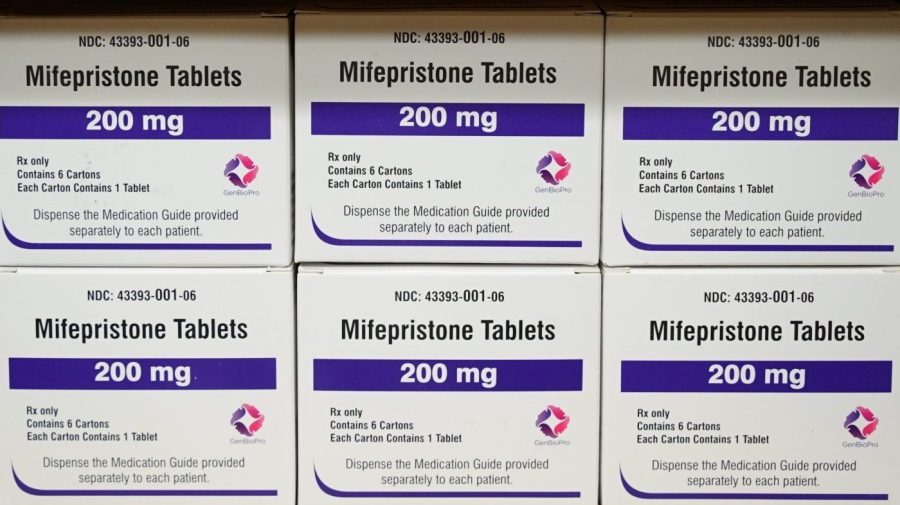 Boxes of the drug mifepristone sit on a shelf/