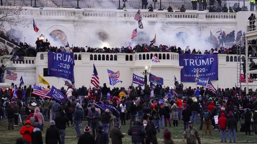 FILE - Violent rioters loyal to President Donald Trump storm the Capitol in Washington on Jan. 6, 2021. Leo Brent Bozell IV, 44, of Palmyra, Pa., the son of a prominent conservative activist, has been convicted of charges that he stormed the U.S. Capitol on Jan. 6, 2021, bashed in a window, chased a police officer, invaded the Senate floor and helped a mob disrupt the certification of Democrat Joe Biden's presidential election victory. Bozell was found guilty Friday, Sept. 8, 2023, of 10 charges, according to a Justice Department news release. (AP Photo/John Minchillo, File)