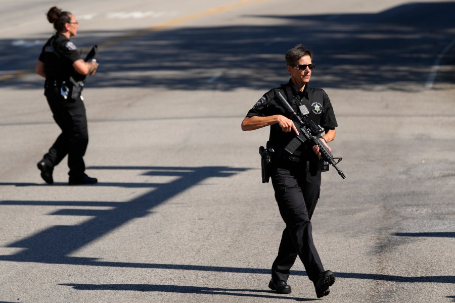 Law enforcement officers stand guard as the search for escaped convict Danelo Cavalcante continues in Pottstown, Pa., Tuesday, Sept. 12, 2023. (AP Photo/Matt Rourke)