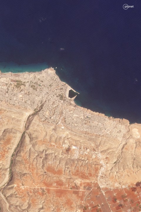 This satellite photo from Planet Labs PBC shows Derna, Libya, on Aug. 31, 2023, before flooding. The destruction came to Derna and other parts of eastern Libya on Sunday night, Sept. 10, 2023. As the storm pounded the coast, Derna residents said they heard loud explosions and realized that dams outside the city had collapsed. (Planet Labs PBC via AP)