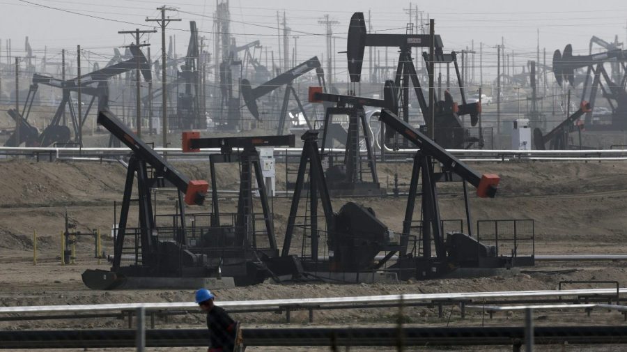 FILE - Pumpjacks operating at the Kern River Oil Field are seen in Bakersfield, Calif., on Jan. 16, 2015. The state of California has filed a lawsuit against some of the world's largest oil and gas companies, claiming they deceived the public about the risks of fossil fuels blamed for climate change-related storms and wildfires that caused billions of dollars in damage. (AP Photo/Jae C. Hong, File)