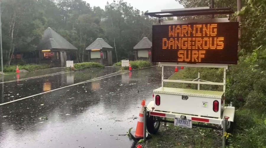 A warning sign is displayed on Park Loop Rd. along shoreline closure at Acadia National Park in Maine on Saturday, Sept. 16, 2023. Severe conditions were predicted across parts of Massachusetts and Maine, and hurricane conditions could hit the Canadian provinces of New Brunswick and Nova Scotia, where the storm, Lee, downgraded early Saturday from hurricane to post-tropical cyclone, was expected to make landfall later in the day.(AP Photo/Robert Bumsted)