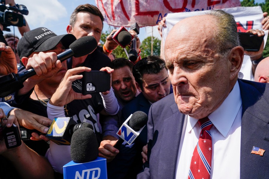 FILE - Rudy Giuliani speaks outside the Fulton County jail, Wednesday, Aug. 23, 2023, in Atlanta. Giuliani on Friday, Sept. 1, pleaded not guilty to Georgia charges that accuse him of trying, along with former President Donald Trump and others, to illegally overturn the results of the 2020 election in the state. (AP Photo/Brynn Anderson, File)