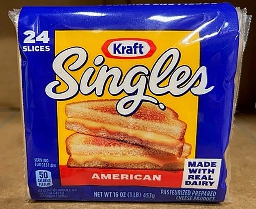 This image provided by Kraft Heinz shows a 24-pack of American cheese slices. Kraft Heinz said Tuesday, Sept. 20, 2023 it's recalling more than 83,000 cases of individually-wrapped Kraft Singles American processed cheese slices because part of the wrapper could stick to the slice and become a choking hazard. (Kraft Heinz via AP)