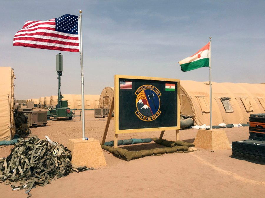 American and Nigerien flags are flown side-by-side at an air base.