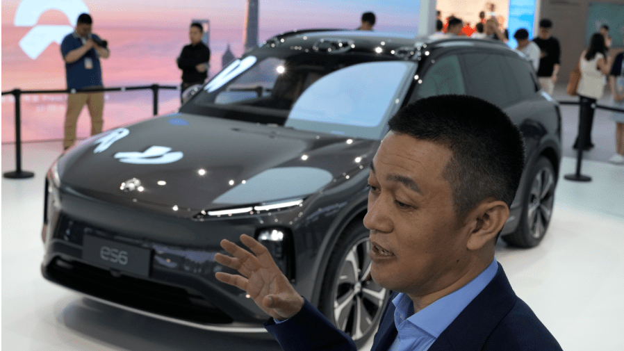 NIO's founder and CEO, William Li speaks near the ES6 during an interview at the Auto Shanghai 2023 show in Shanghai, Tuesday, April 18, 2023.