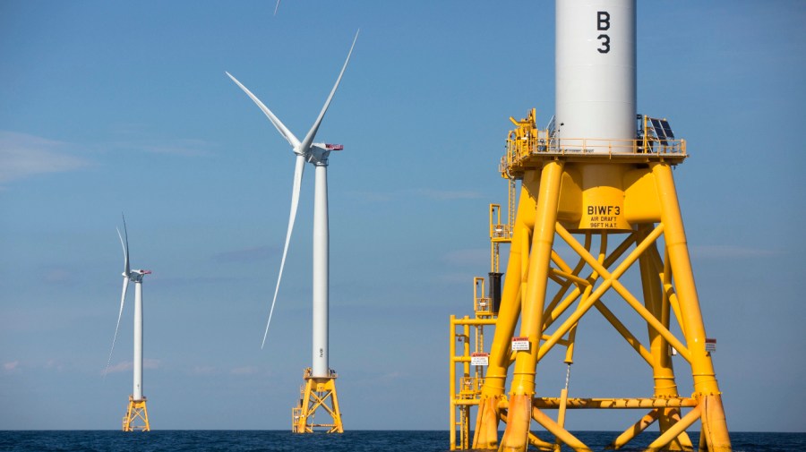 Three of Deepwater Wind's turbines stand in the water off Block Island, R.I.